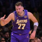 Dec 10, 2025; Los Angeles, California, USA; Los Angeles Lakers guard Luka Doncic (77) reacts after a 3-point basket during the first half against the San Antonio Spurs at Crypto.com Arena. Mandatory Credit: Jayne Kamin-Oncea-Imagn Images