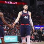 Dec 11, 2025; Houston, Texas, USA; Los Angeles Clippers center Ivica Zubac (40) shakes hands with forward Kawhi Leonard (2) after a play during the second quarter against the Houston Rockets at Toyota Center. Mandatory Credit: Troy Taormina-Imagn Images