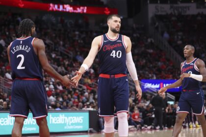 Dec 11, 2025; Houston, Texas, USA; Los Angeles Clippers center Ivica Zubac (40) shakes hands with forward Kawhi Leonard (2) after a play during the second quarter against the Houston Rockets at Toyota Center. Mandatory Credit: Troy Taormina-Imagn Images