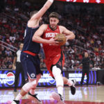 Dec 11, 2025; Houston, Texas, USA; Houston Rockets center Alperen Sengun (28) drives with the ball as Los Angeles Clippers center Ivica Zubac (40) defends during the fourth quarter at Toyota Center. Mandatory Credit: Troy Taormina-Imagn Images