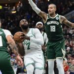 Dec 11, 2025; Milwaukee, Wisconsin, USA; Boston Celtics forward Jaylen Brown (7) looks for a shot against Milwaukee Bucks forward Kyle Kuzma (18) in the fourth quarter at Fiserv Forum. Mandatory Credit: Benny Sieu-Imagn Images
