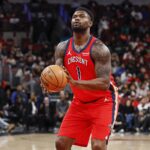 Dec 14, 2025; Chicago, Illinois, USA; New Orleans Pelicans forward Zion Williamson (1) shoots a free throw against the Chicago Bulls during the second half at United Center. Mandatory Credit: Kamil Krzaczynski-Imagn Images
