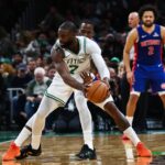 Dec 15, 2025; Boston, Massachusetts, USA; Detroit Pistons guard Javonte Green (31) reaches in to try to knock the ball away from Boston Celtics guard Jaylen Brown (7) during the second quarter at TD Garden. Mandatory Credit: Winslow Townson-Imagn Images