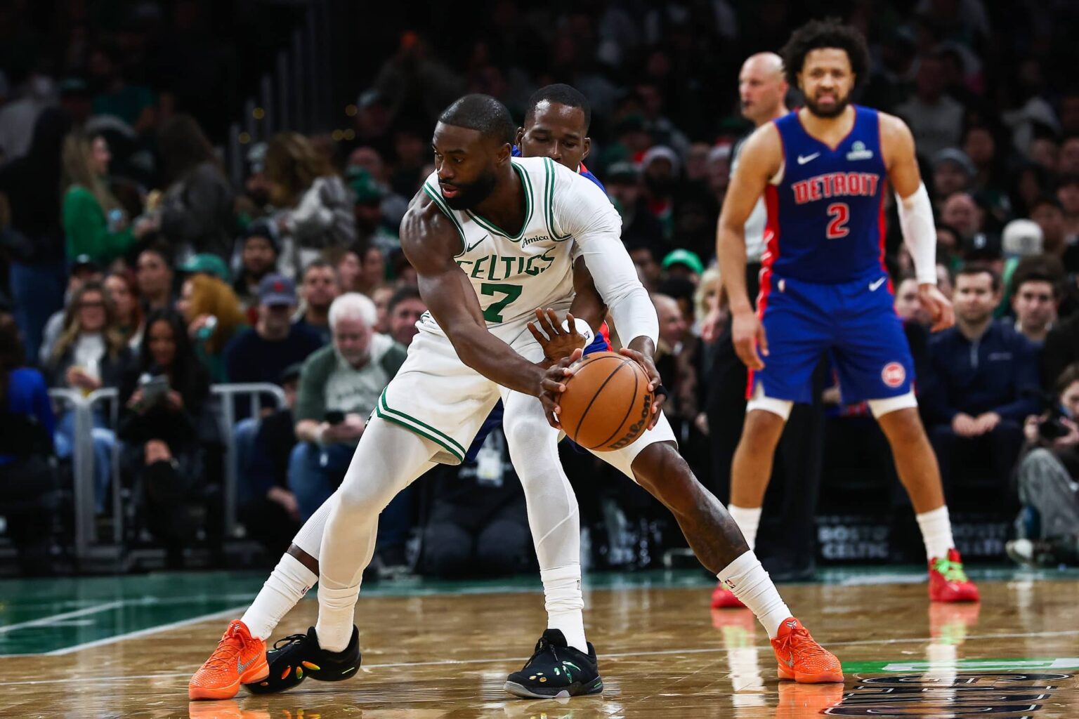 Dec 15, 2025; Boston, Massachusetts, USA; Detroit Pistons guard Javonte Green (31) reaches in to try to knock the ball away from Boston Celtics guard Jaylen Brown (7) during the second quarter at TD Garden. Mandatory Credit: Winslow Townson-Imagn Images