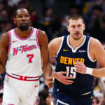 Dec 15, 2025; Denver, Colorado, USA; Houston Rockets forward Kevin Durant (7) and Denver Nuggets center Nikola Jokic (15) during the second quarter at Ball Arena. Mandatory Credit: Ron Chenoy-Imagn Images