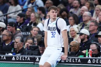 Dec 15, 2025; Salt Lake City, Utah, USA; Dallas Mavericks forward Cooper Flagg (32) waits to check in to the game against the Utah Jazz during the second half at Delta Center. Mandatory Credit: Rob Gray-Imagn Images