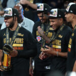 Dec 16, 2025; Las Vegas, Nevada, USA; New York Knicks guard Jalen Brunson (11) holds the MVP trophy after winning the Emirates NBA Cup Final at T-Mobile Arena. Mandatory Credit: Kirby Lee-Imagn Images