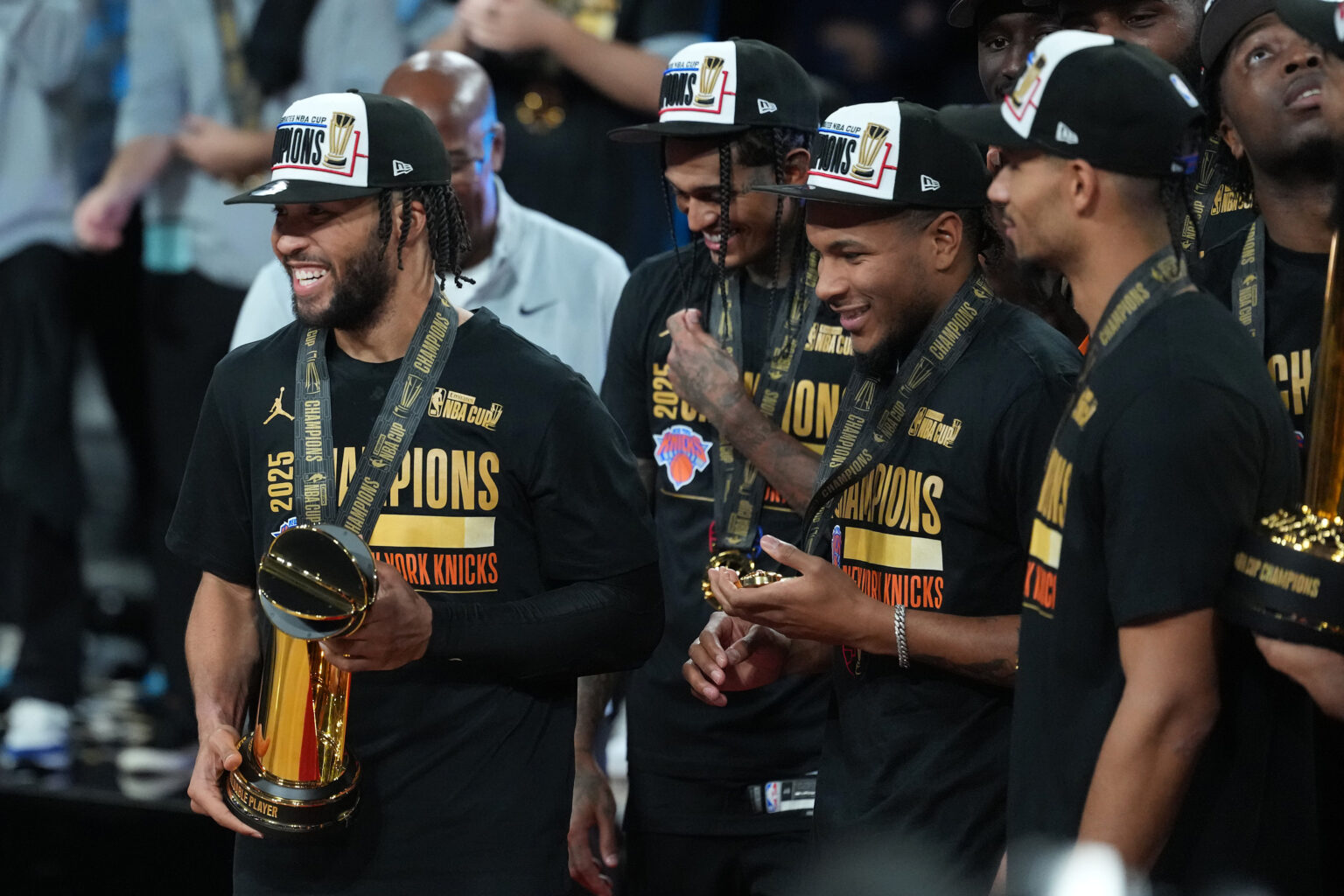 Dec 16, 2025; Las Vegas, Nevada, USA; New York Knicks guard Jalen Brunson (11) holds the MVP trophy after winning the Emirates NBA Cup Final at T-Mobile Arena. Mandatory Credit: Kirby Lee-Imagn Images