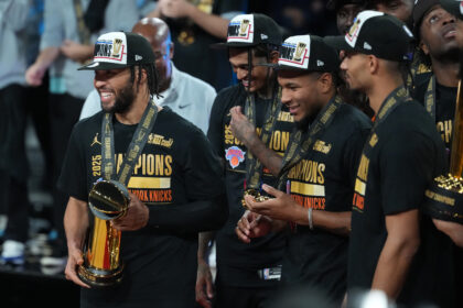 Dec 16, 2025; Las Vegas, Nevada, USA; New York Knicks guard Jalen Brunson (11) holds the MVP trophy after winning the Emirates NBA Cup Final at T-Mobile Arena. Mandatory Credit: Kirby Lee-Imagn Images