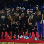 Dec 16, 2025; Las Vegas, Nevada, USA; The New York Knicks pose for a photograph after winning the Emirates NBA Cup Final at T-Mobile Arena. Mandatory Credit: Kirby Lee-Imagn Images