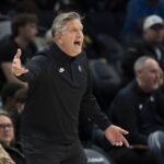 Dec 17, 2025; Minneapolis, Minnesota, USA; Minnesota Timberwolves head coach Chris Finch reacts towards an official after a call against the Memphis Grizzlies in the second half at Target Center. Mandatory Credit: Jesse Johnson-Imagn Images