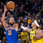 Dec 18, 2025; Indianapolis, Indiana, USA; New York Knicks guard Jalen Brunson (11) shoots the winning shot while Indiana Pacers guard/forward Andrew Nembhard (2) defends in the second half at Gainbridge Fieldhouse. Mandatory Credit: Trevor Ruszkowski-Imagn Images