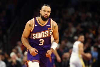Dec 18, 2025; Phoenix, Arizona, USA; Phoenix Suns forward Dillon Brooks (3) against the Golden State Warriors in the first half at Mortgage Matchup Center. Mandatory Credit: Mark J. Rebilas-Imagn Images