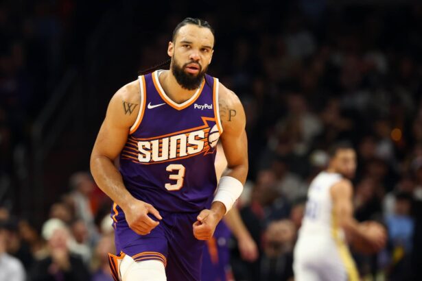 Dec 18, 2025; Phoenix, Arizona, USA; Phoenix Suns forward Dillon Brooks (3) against the Golden State Warriors in the first half at Mortgage Matchup Center. Mandatory Credit: Mark J. Rebilas-Imagn Images