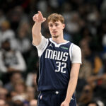 Dec 18, 2025; Dallas, Texas, USA; Dallas Mavericks forward Cooper Flagg (32) motions to his teammates during the second quarter against the Detroit Pistons at the American Airlines Center. Mandatory Credit: Jerome Miron-Imagn Images