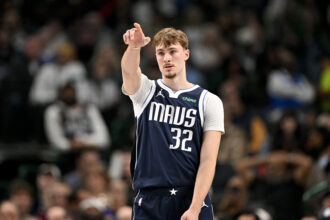 Dec 18, 2025; Dallas, Texas, USA; Dallas Mavericks forward Cooper Flagg (32) motions to his teammates during the second quarter against the Detroit Pistons at the American Airlines Center. Mandatory Credit: Jerome Miron-Imagn Images