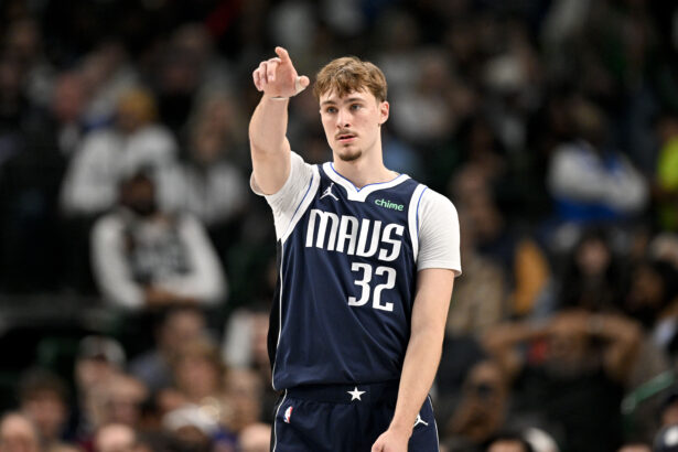 Dec 18, 2025; Dallas, Texas, USA; Dallas Mavericks forward Cooper Flagg (32) motions to his teammates during the second quarter against the Detroit Pistons at the American Airlines Center. Mandatory Credit: Jerome Miron-Imagn Images