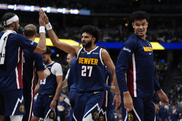Dec 18, 2025; Denver, Colorado, USA; Denver Nuggets guard Jamal Murray (27) reacts in the second quarter against the Orlando Magic at Ball Arena. Mandatory Credit: Ron Chenoy-Imagn Images
