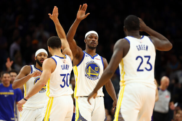 Dec 18, 2025; Phoenix, Arizona, USA; Golden State Warriors forward Jimmy Butler III (10) celebrates with guard Stephen Curry (30) and forward Draymond Green (23) against the Phoenix Suns in the second half at Mortgage Matchup Center. Mandatory Credit: Mark J. Rebilas-Imagn Images