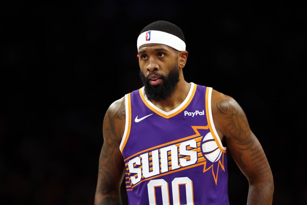 Dec 18, 2025; Phoenix, Arizona, USA; Phoenix Suns forward Royce O'Neale (00) against the Golden State Warriors at Mortgage Matchup Center. Mandatory Credit: Mark J. Rebilas-Imagn Images