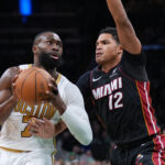 Dec 19, 2025; Boston, Massachusetts, USA; Boston Celtics guard Jaylen Brown (7) drives the ball against Miami Heat guard Dru Smith (12) in the second half at TD Garden. Mandatory Credit: David Butler II-Imagn Images