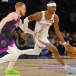 Dec 19, 2025; Minneapolis, Minnesota, USA; Oklahoma City Thunder guard Shai Gilgeous-Alexander (2) works past Minnesota Timberwolves guard Donte DiVincenzo (0) in the first quarter at Target Center. Mandatory Credit: Bruce Kluckhohn-Imagn Images
