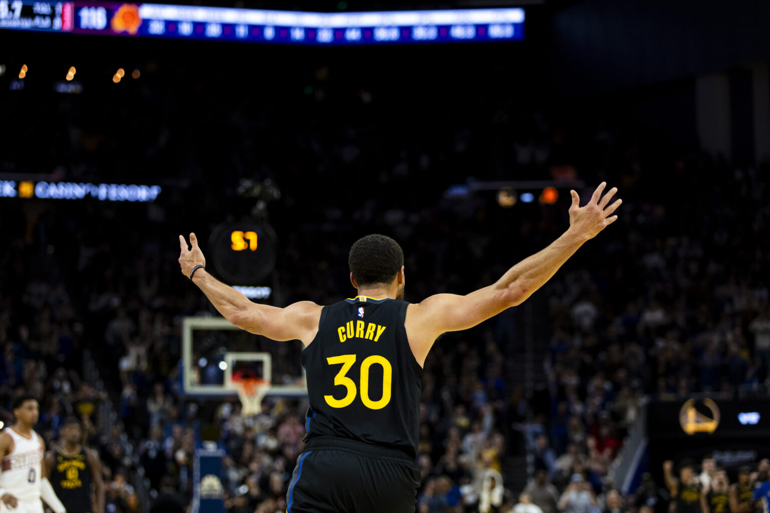 Dec 20, 2025; San Francisco, California, USA; Golden State Warriors guard Stephen Curry (30) reacts after scoring against the Phoenix Suns during the fourth quarter at Chase Center. Mandatory Credit: John Hefti-Imagn Images