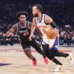 Dec 21, 2025; New York, New York, USA; New York Knicks guard Jalen Brunson (11) drives past Miami Heat guard Davion Mitchell (45) in the first quarter at Madison Square Garden. Mandatory Credit: Wendell Cruz-Imagn Images