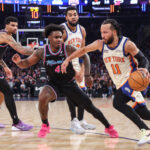 Dec 21, 2025; New York, New York, USA; New York Knicks guard Jalen Brunson (11) drives past Miami Heat guard Davion Mitchell (45) in the first quarter at Madison Square Garden. Mandatory Credit: Wendell Cruz-Imagn Images