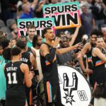 Dec 23, 2025; San Antonio, Texas, USA; San Antonio Spurs forward Victor Wembanyama (1) leads fans on a cheer after a victory over the Oklahoma City Thunder at Frost Bank Center. Mandatory Credit: Scott Wachter-Imagn Images