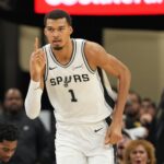 Dec 27, 2025; San Antonio, Texas, USA; San Antonio Spurs forward Victor Wembanyama (1) reacts after scoring during the first half against the Utah Jazz at Frost Bank Center. Mandatory Credit: Scott Wachter-Imagn Images