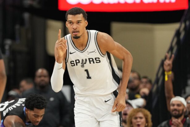 Dec 27, 2025; San Antonio, Texas, USA; San Antonio Spurs forward Victor Wembanyama (1) reacts after scoring during the first half against the Utah Jazz at Frost Bank Center. Mandatory Credit: Scott Wachter-Imagn Images