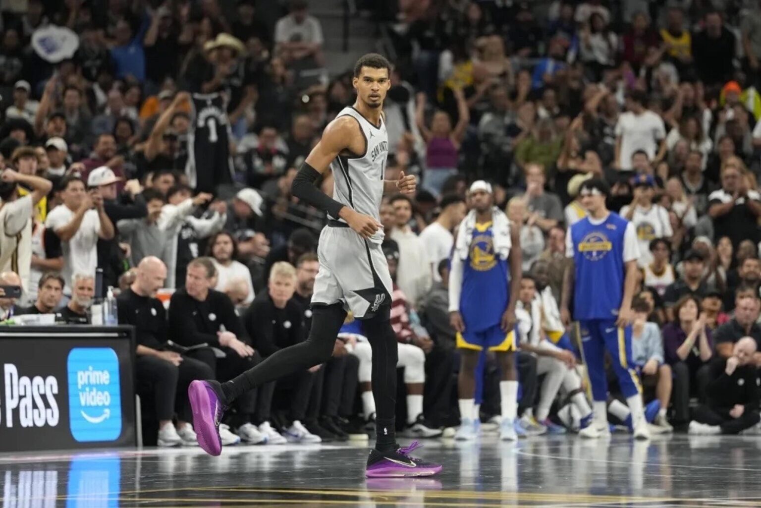 Nov 14, 2025; San Antonio, Texas, USA; San Antonio Spurs forward Victor Wembanyama (1) gets back on defense after scoring a three-point basket during the second half against the Golden State Warriors at Frost Bank Center. Mandatory Credit: Scott Wachter-Imagn Images