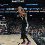 Nov 8, 2025; San Antonio, Texas, USA; San Antonio Spurs forward Victor Wembanyama (1) takes a three point shot in the second half against the New Orleans Pelicans at Frost Bank Center. Mandatory Credit: Daniel Dunn-Imagn Images