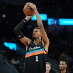 Dec 29, 2025; San Antonio, Texas, USA; San Antonio Spurs forward Victor Wembanyama (1) shoots a free throw in the second half against the Cleveland Cavaliers at Frost Bank Center. Mandatory Credit: Daniel Dunn-Imagn Images