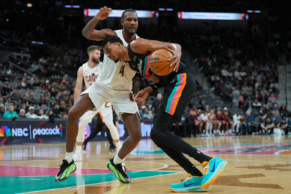 Dec 29, 2025; San Antonio, Texas, USA; San Antonio Spurs forward Victor Wembanyama (1) drives in against Cleveland Cavaliers center Evan Mobley (4) in the second half at Frost Bank Center. Mandatory Credit: Daniel Dunn-Imagn Images