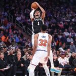 Dec 25, 2024; New York, New York, USA; San Antonio Spurs center Victor Wembanyama (1) shoots over New York Knicks center Karl-Anthony Towns (32) in the first quarter at Madison Square Garden. Mandatory Credit: Wendell Cruz-Imagn Images