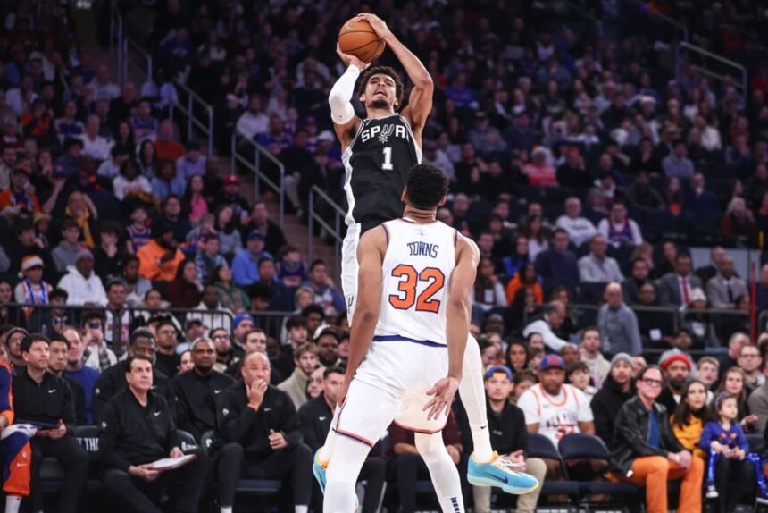 Dec 25, 2024; New York, New York, USA; San Antonio Spurs center Victor Wembanyama (1) shoots over New York Knicks center Karl-Anthony Towns (32) in the first quarter at Madison Square Garden. Mandatory Credit: Wendell Cruz-Imagn Images