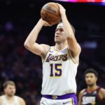 Philadelphia, Pennsylvania, USA; Los Angeles Lakers guard Austin Reaves (15) shoots a foul shot against the Philadelphia 76ers during the fourth quarter at Xfinity Mobile Arena. Mandatory Credit: Bill Streicher-Imagn Images