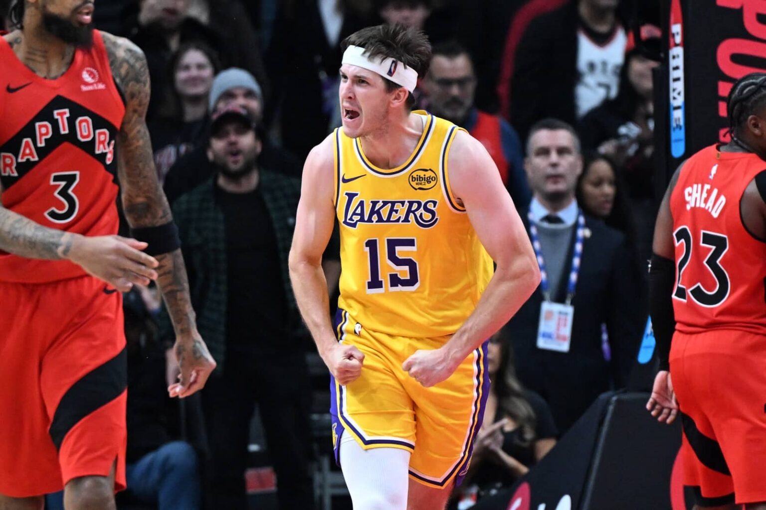 Toronto, Ontario, CAN; Los Angeles Lakers guard Austin Reaves (15) reacts after scoring a basket against the Toronto Raptors in the second half at Scotiabank Arena. Mandatory Credit: Dan Hamilton-Imagn Images