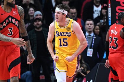 Toronto, Ontario, CAN; Los Angeles Lakers guard Austin Reaves (15) reacts after scoring a basket against the Toronto Raptors in the second half at Scotiabank Arena. Mandatory Credit: Dan Hamilton-Imagn Images