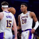 Los Angeles, California, USA; Los Angeles Lakers guard Austin Reaves (15) and forward Rui Hachimura (28) celebrate the victory against the Indiana Pacers at Crypto.com Arena. Mandatory Credit: Gary A. Vasquez-Imagn Images