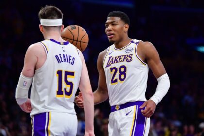 Los Angeles, California, USA; Los Angeles Lakers guard Austin Reaves (15) and forward Rui Hachimura (28) celebrate the victory against the Indiana Pacers at Crypto.com Arena. Mandatory Credit: Gary A. Vasquez-Imagn Images