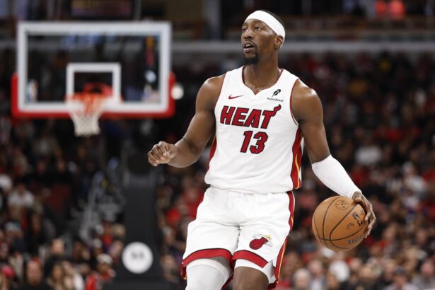 Chicago, Illinois, USA; Miami Heat center Bam Adebayo (13) brings the ball up court against the Chicago Bulls during the second half at United Center. Mandatory Credit: Kamil Krzaczynski-Imagn Images