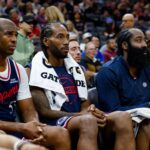 Sacramento, California, USA; Los Angeles Clippers guard Chris Paul (3) and forward Kawhi Leonard (2) and guard James Harden (1) sit on the bench during the fourth quarter against the Sacramento Kings at Golden 1 Center. Mandatory Credit: Sergio Estrada-Imagn Images