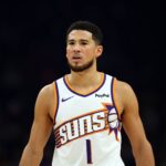 Phoenix, Arizona, USA; Phoenix Suns guard Devin Booker (1) against the Houston Rockets in the first half at Mortgage Matchup Center. Mandatory Credit: Mark J. Rebilas-Imagn Images