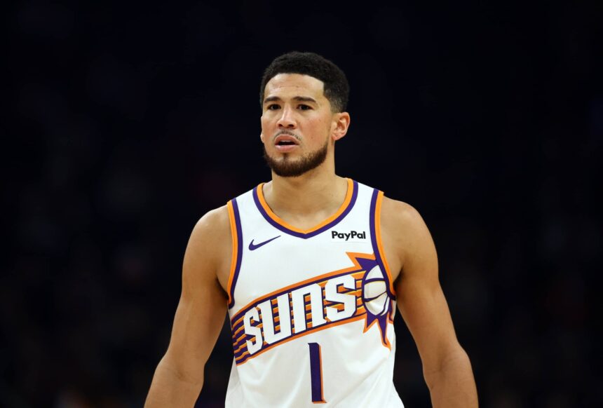 Phoenix, Arizona, USA; Phoenix Suns guard Devin Booker (1) against the Houston Rockets in the first half at Mortgage Matchup Center. Mandatory Credit: Mark J. Rebilas-Imagn Images