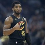 Cleveland, Ohio, USA; Cleveland Cavaliers guard Donovan Mitchell (45) stands on the court in the first quarter against the Charlotte Hornets at Rocket Arena. Mandatory Credit: David Richard-Imagn Images