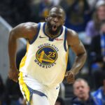 San Francisco, California, USA; Golden State Warriors forward Draymond Green (23) reacts after making a three point basket against the Dallas Mavericks during the second quarter at Chase Center. Mandatory Credit: Darren Yamashita-Imagn Images