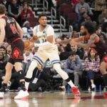 Chicago, Illinois, USA; Chicago Bulls guard Coby White (0) defends Milwaukee Bucks forward Giannis Antetokounmpo (34)during the first half at United Center. Mandatory Credit: David Banks-Imagn Images